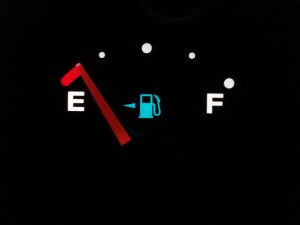 "photo of gas tank gauge on empty"