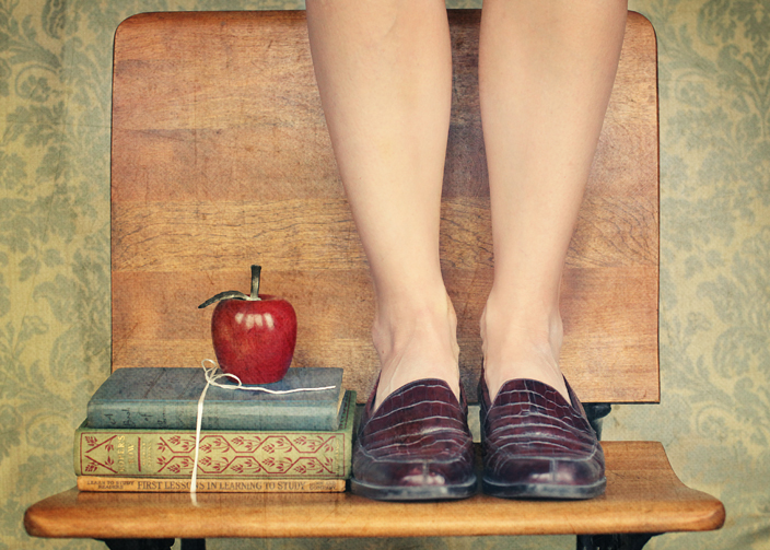 "photo of school books, apple and feet on a vintage bench", "back to school photo"