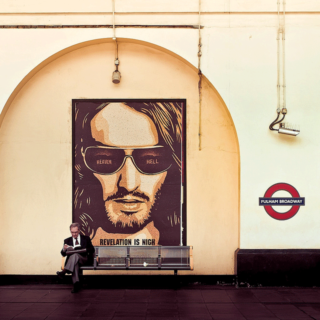 "photo of large poster of russel brand in lodon underground"