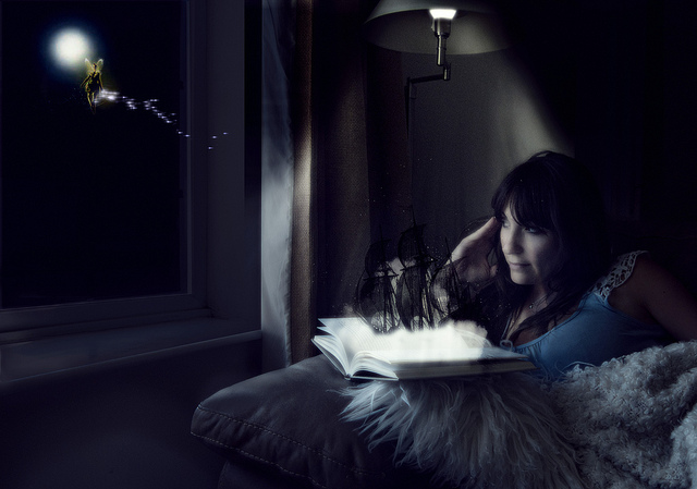 "image of girl dreaming while reading peter pan"