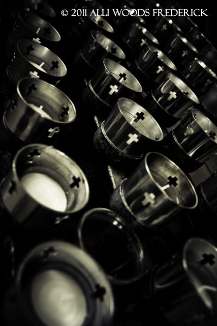 "photo of candles in a catholic church by alli woods frederick" 